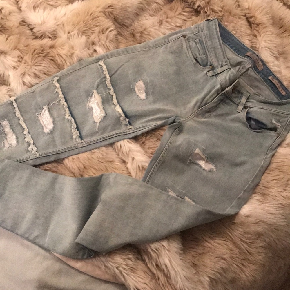 Power skinny mid rise distressed jeans